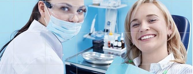 Dentist and patient smiling
